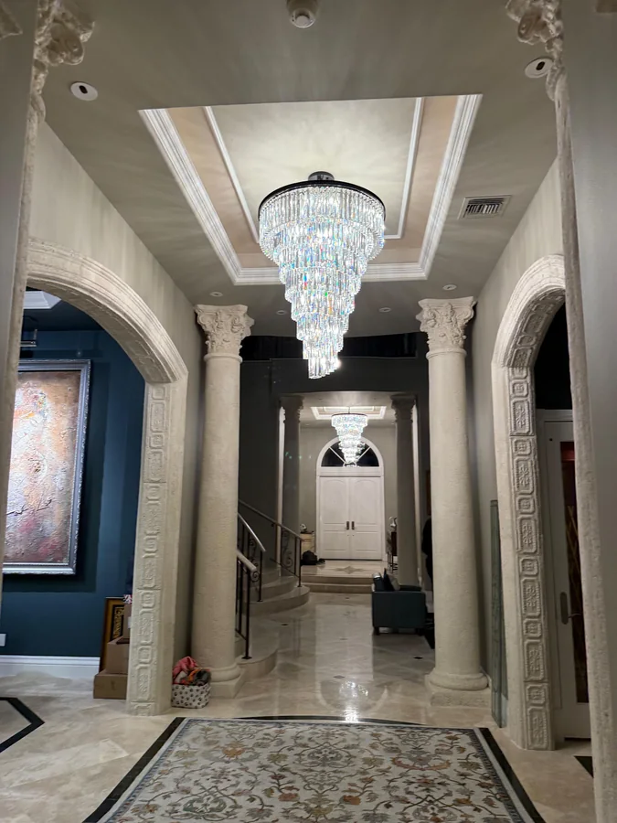 Finished entry hall and chandelier at 464 Addison Park Lane, Boca Raton
