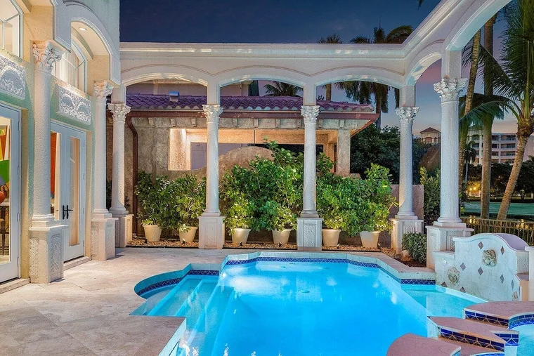 Pool and columned loggia at dusk - 464 Addison Park Lane, Boca Raton